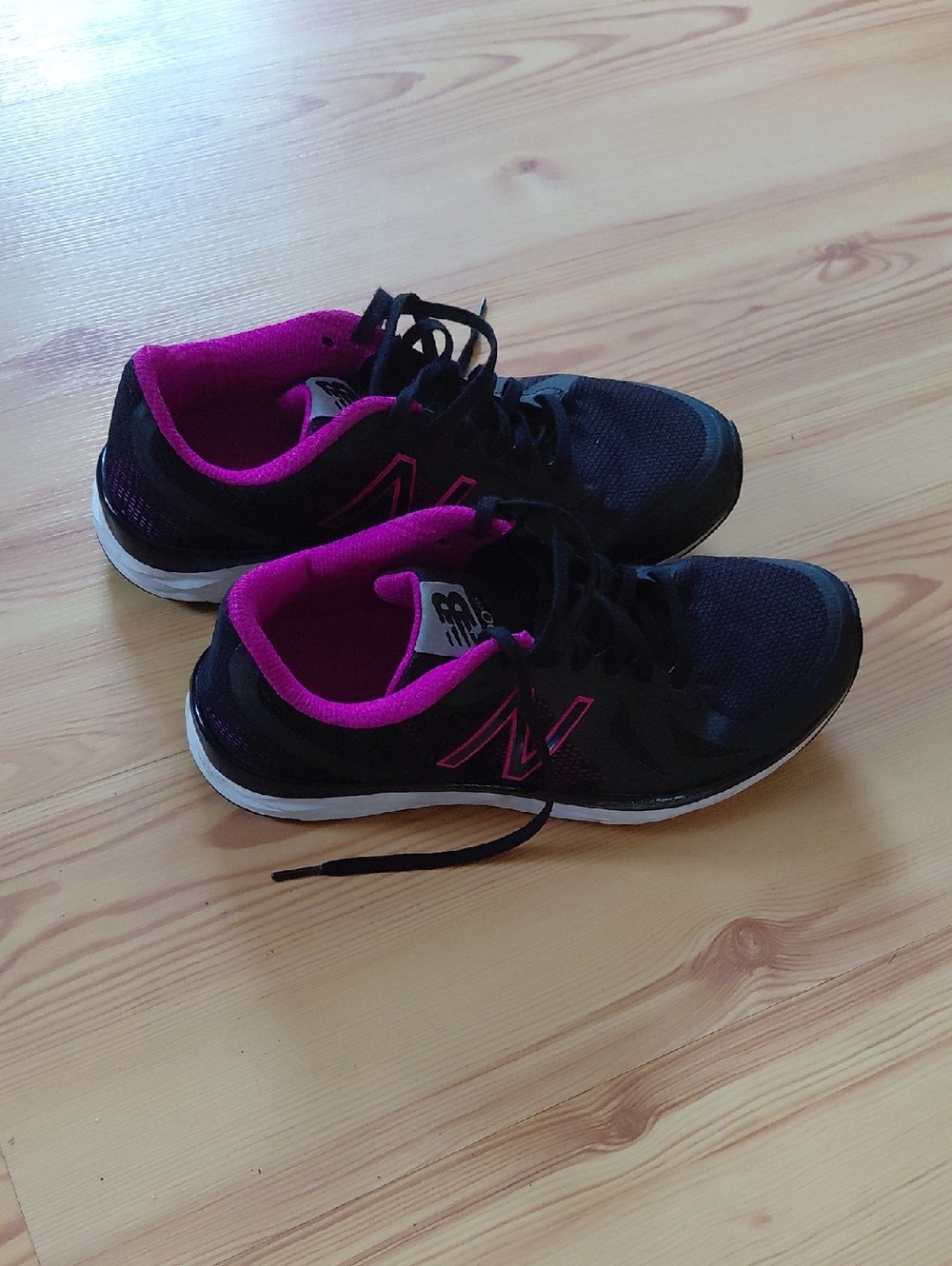 New Balance Women's Black Athletic Sneakers with Pink Accents